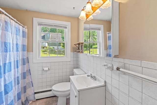 9 Bryant Rd, Nashua, NH 03062 - bathroom featuring baseboard heating, tile walls, vanity, a wainscoted wall, and a shower with shower curtain