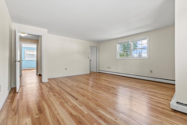 9 Bryant Rd, Nashua, NH 03062 - spare room with a baseboard radiator and light wood-type flooring