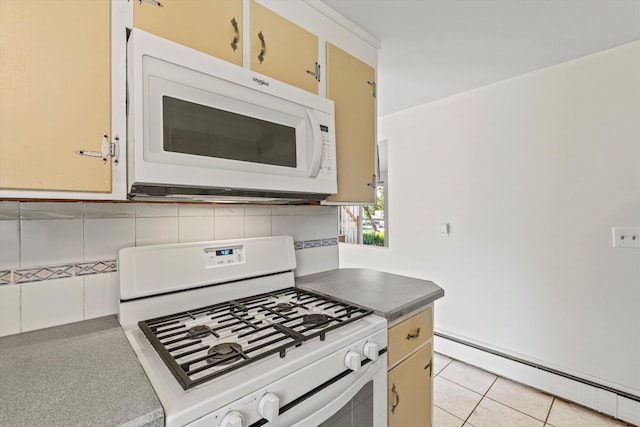 9 Bryant Rd, Nashua, NH 03062 - kitchen with white appliances, a baseboard heating unit, tasteful backsplash, and light tile patterned floors