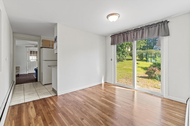 9 Bryant Rd, Nashua, NH 03062 - spare room featuring baseboard heating and wood finished floors