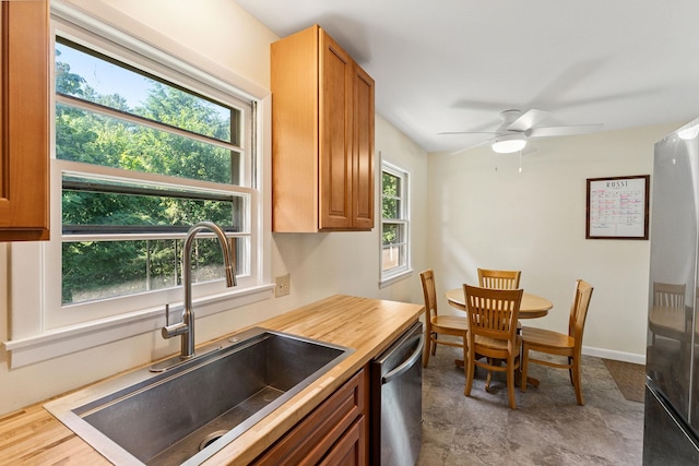 41 Foster Rd, Essex, VT 05452 - kitchen featuring stainless steel appliances, ceiling fan, brown cabinets, and wood counters