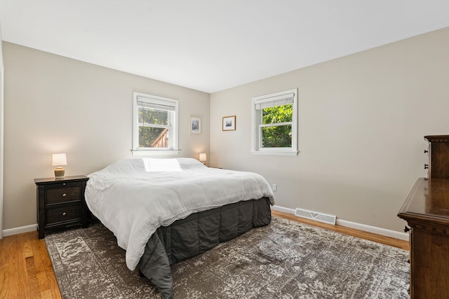 41 Foster Rd, Essex, VT 05452 - bedroom featuring multiple windows and wood finished floors
