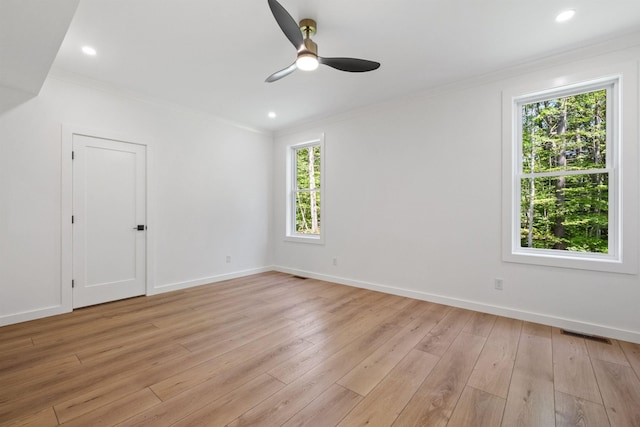 74 Scenic View Rd, Ashland, NH 03217 - empty room featuring plenty of natural light, ornamental molding, a ceiling fan, light wood-style floors, and recessed lighting