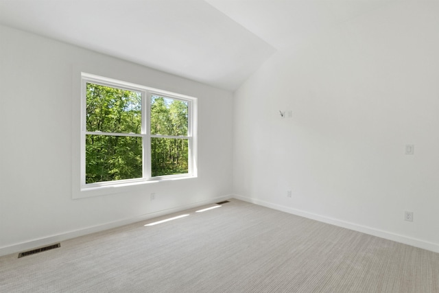 74 Scenic View Rd, Ashland, NH 03217 - unfurnished room with light carpet and vaulted ceiling