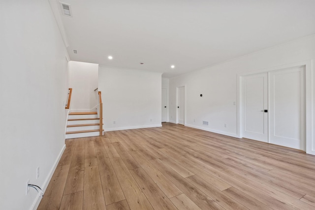 74 Scenic View Rd, Ashland, NH 03217 - unfurnished room with light wood-style floors, stairs, recessed lighting, and crown molding