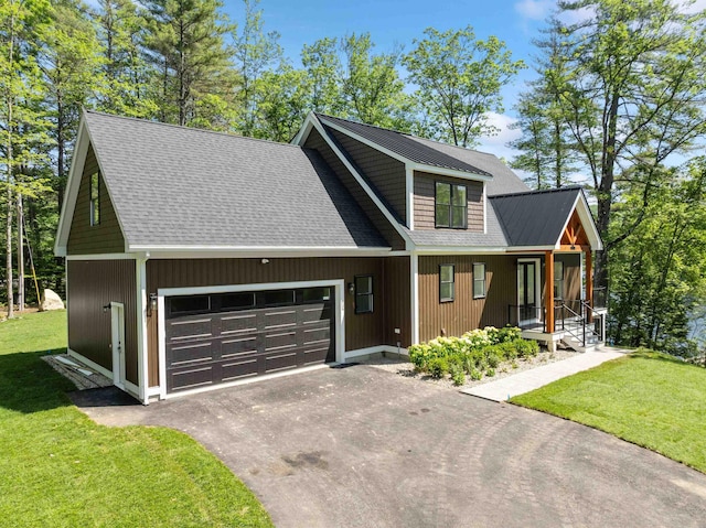 74 Scenic View Rd, Ashland, NH 03217 - view of front of house featuring an attached garage, driveway, covered porch, a front yard, and a shingled roof