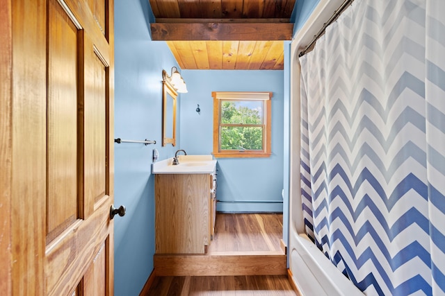 43 Knights Pond Rd, South Berwick, ME 03908 - bathroom featuring wood ceiling, a baseboard radiator, vanity, and wood finished floors