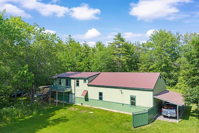 43 Knights Pond Rd, South Berwick, ME 03908 - back of house with a carport, a yard, a metal roof, a view of trees, and a wooden deck