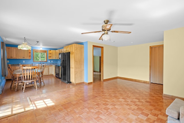 43 Knights Pond Rd, South Berwick, ME 03908 - kitchen featuring black appliances, open floor plan, ceiling fan, and light countertops