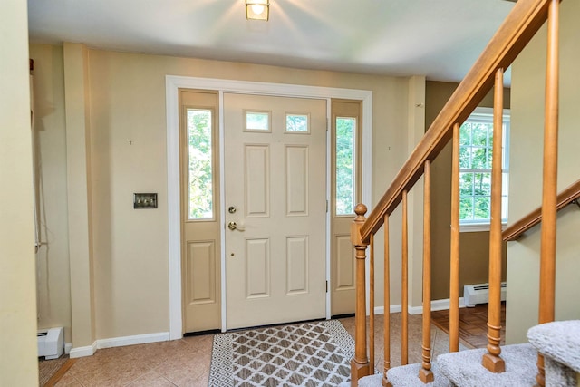 21 Winter Dr, Hooksett, NH 03106 - entrance foyer featuring baseboard heating, healthy amount of natural light, and stairway