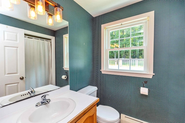 21 Winter Dr, Hooksett, NH 03106 - bathroom with vanity, baseboard heating, and a shower with curtain