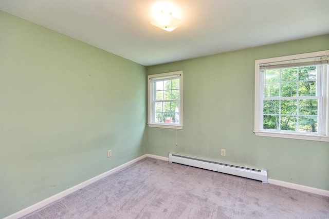 21 Winter Dr, Hooksett, NH 03106 - spare room with a baseboard radiator and carpet
