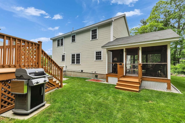 21 Winter Dr, Hooksett, NH 03106 - back of house with a sunroom, a shingled roof, a lawn, and a deck
