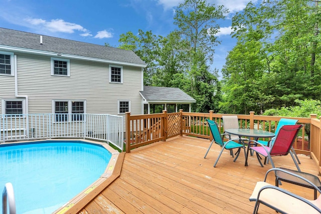 21 Winter Dr, Hooksett, NH 03106 - swimming pool with a deck, outdoor dining area, and view of scattered trees