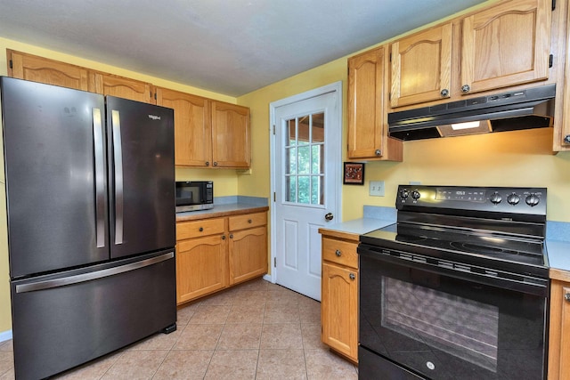 21 Winter Dr, Hooksett, NH 03106 - kitchen with appliances with stainless steel finishes, under cabinet range hood, light countertops, and light tile patterned floors