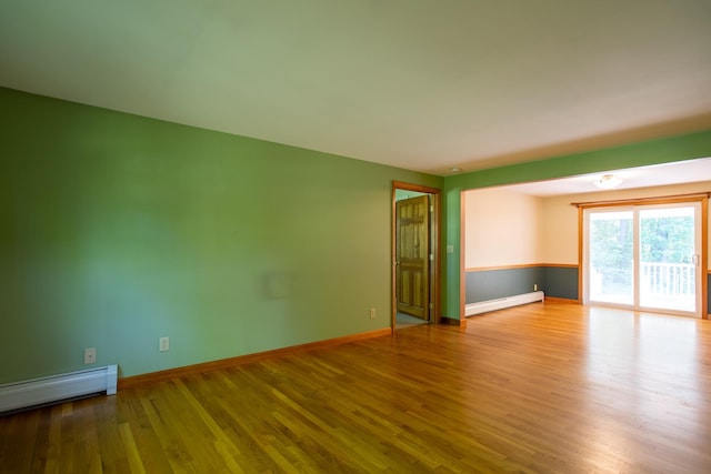 144 Packers Falls Rd, Durham, NH 03824 - empty room with a baseboard radiator and wood finished floors