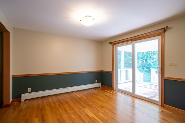 144 Packers Falls Rd, Durham, NH 03824 - spare room with a baseboard radiator and wood finished floors