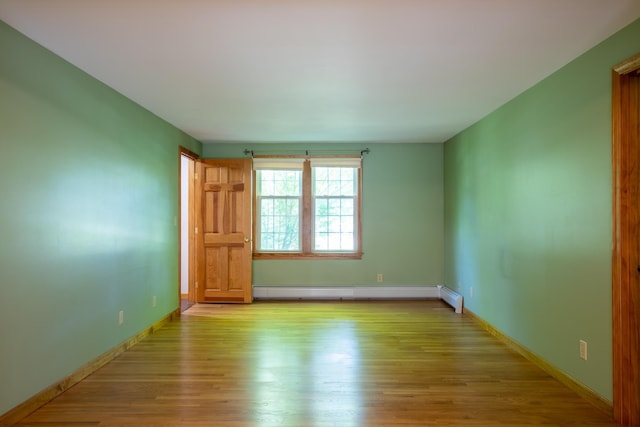 144 Packers Falls Rd, Durham, NH 03824 - spare room with wood finished floors and baseboard heating