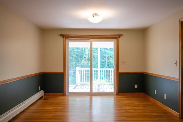 144 Packers Falls Rd, Durham, NH 03824 - empty room with a baseboard radiator and wood finished floors