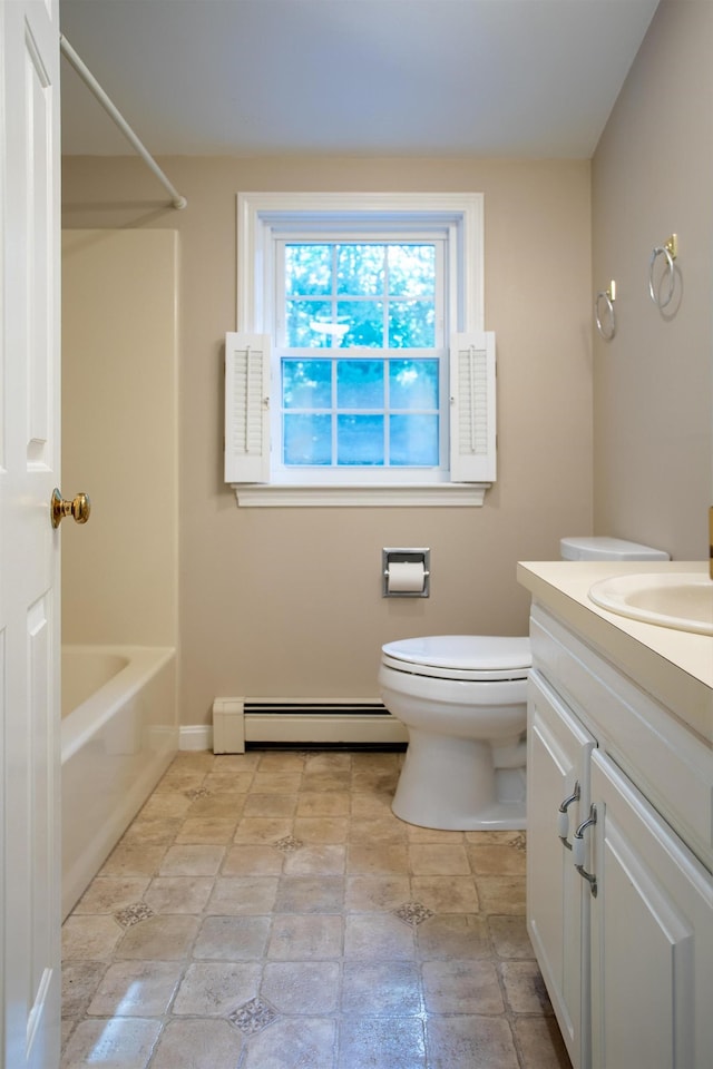 144 Packers Falls Rd, Durham, NH 03824 - bathroom featuring a baseboard heating unit, vanity, bathing tub / shower combination, and stone finish floors