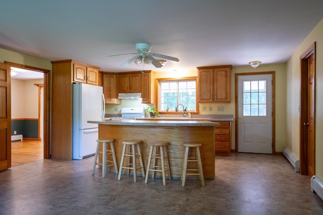 144 Packers Falls Rd, Durham, NH 03824 - kitchen featuring white appliances, under cabinet range hood, a kitchen breakfast bar, a ceiling fan, and a center island