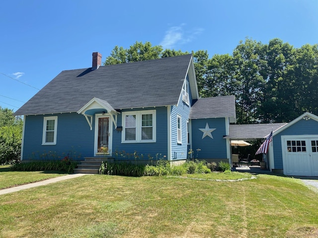 34 Dewey St, Springfield, VT 05156 - view of front facade with a front yard, a chimney, a shingled roof, and an outdoor structure