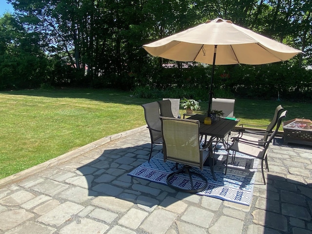 34 Dewey St, Springfield, VT 05156 - view of patio / terrace with a fire pit, outdoor dining area, and view of wooded area