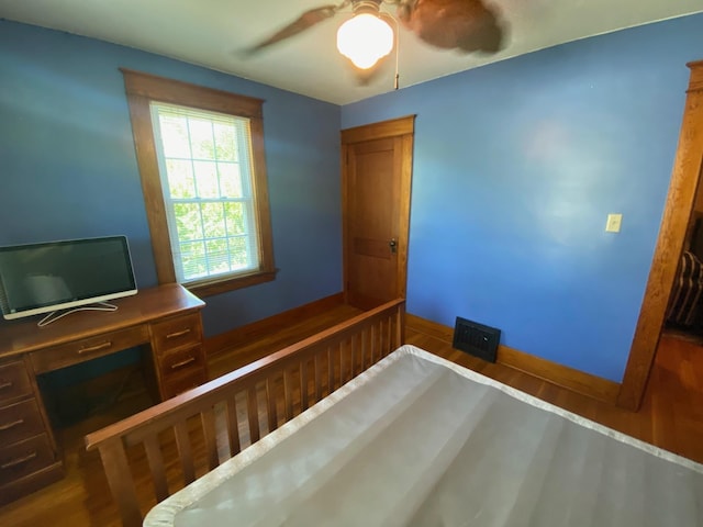 34 Dewey St, Springfield, VT 05156 - unfurnished bedroom featuring wood finished floors, a ceiling fan, and an office area