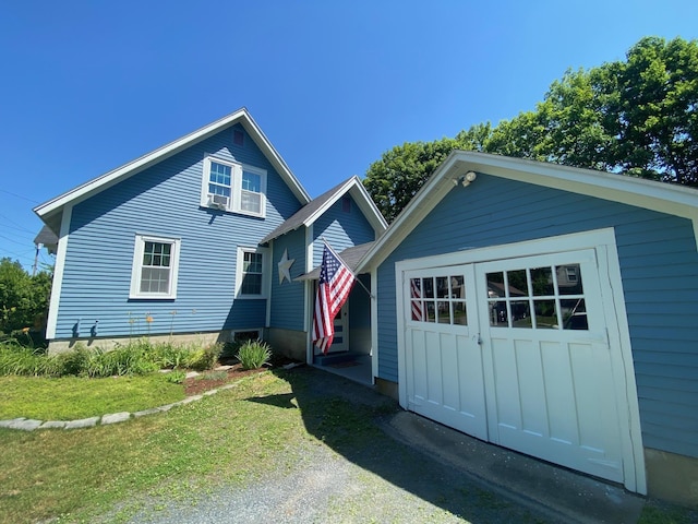 34 Dewey St, Springfield, VT 05156 - view of front of house with an outdoor structure and a front lawn