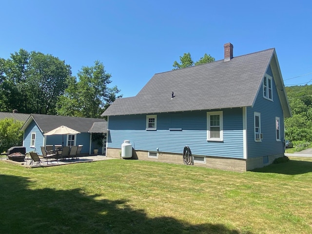 34 Dewey St, Springfield, VT 05156 - rear view of property with a chimney, a lawn, a shingled roof, a patio area, and cooling unit
