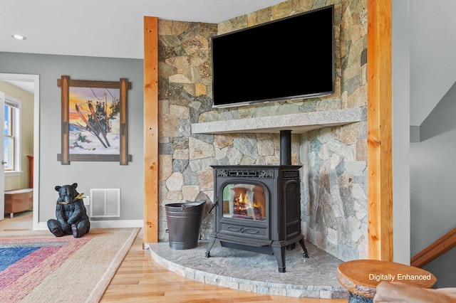 53 Ammonoosuc Dr, Bartlett, NH 03812 - detailed view of a wood stove, wood finished floors, and recessed lighting