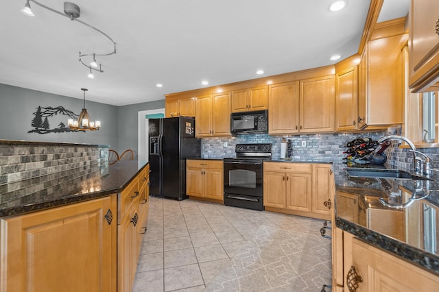 53 Ammonoosuc Dr, Bartlett, NH 03812 - kitchen featuring black appliances, tasteful backsplash, light tile patterned floors, dark stone countertops, and a chandelier