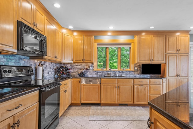 53 Ammonoosuc Dr, Bartlett, NH 03812 - kitchen featuring black appliances, dark stone counters, backsplash, recessed lighting, and light tile patterned floors