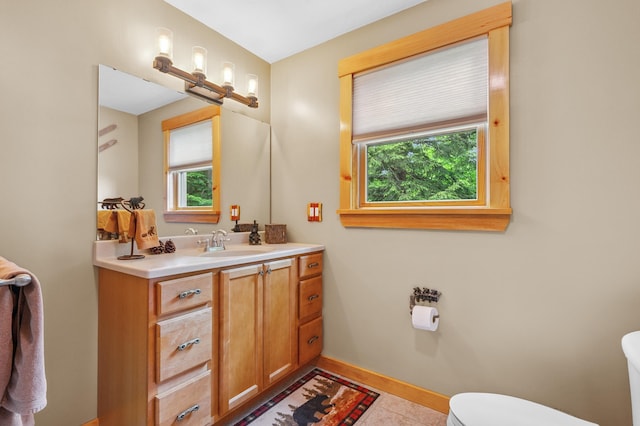 53 Ammonoosuc Dr, Bartlett, NH 03812 - half bath with plenty of natural light, vanity, and tile patterned floors