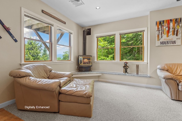 53 Ammonoosuc Dr, Bartlett, NH 03812 - living area with a wood stove, carpet, and recessed lighting