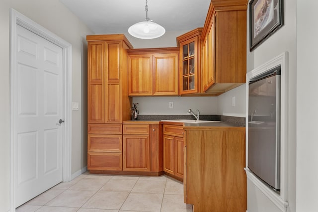 53 Ammonoosuc Dr, Bartlett, NH 03812 - kitchen with brown cabinets, dark countertops, glass insert cabinets, and hanging light fixtures