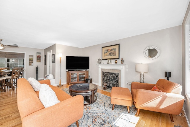4 Chestnut St, Hudson, NH 03051 - living room with ceiling fan, wood finished floors, and a high end fireplace