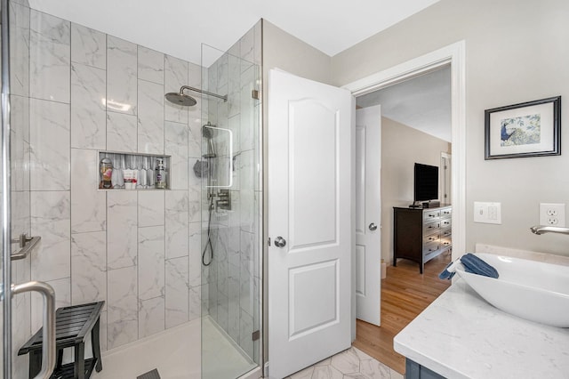 4 Chestnut St, Hudson, NH 03051 - bathroom featuring a stall shower, vanity, and wood finished floors