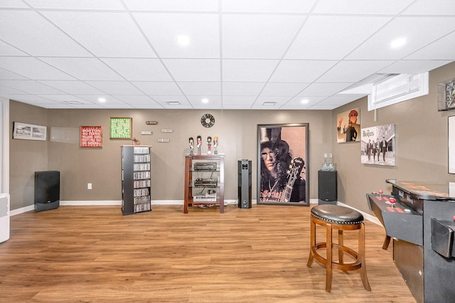 4 Chestnut St, Hudson, NH 03051 - bar featuring light wood-style flooring, a paneled ceiling, and recessed lighting