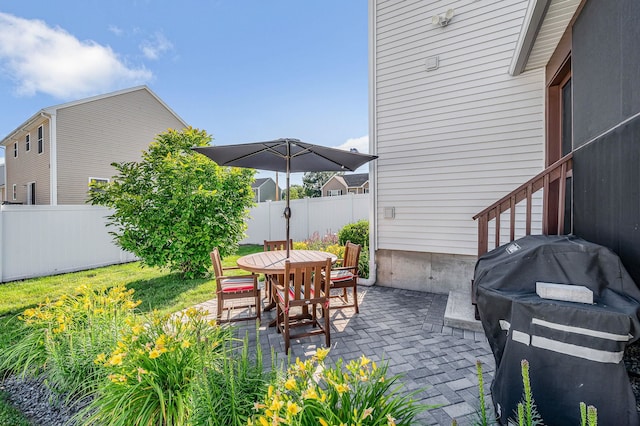 4 Chestnut St, Hudson, NH 03051 - fenced backyard with a patio area and outdoor dining space