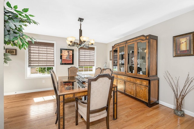 4 Chestnut St, Hudson, NH 03051 - dining space featuring a chandelier, plenty of natural light, and light wood finished floors