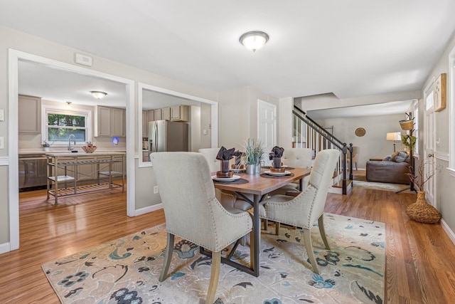 5 Catskill Dr, Merrimack, NH 03054 - dining space with stairway and light wood-style flooring