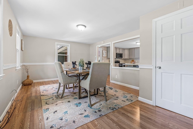 5 Catskill Dr, Merrimack, NH 03054 - dining space featuring light wood-style flooring and baseboards