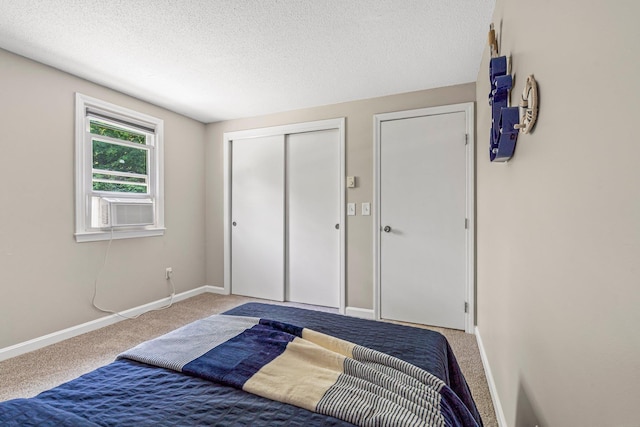 5 Catskill Dr, Merrimack, NH 03054 - bedroom with carpet floors, cooling unit, a closet, and a textured ceiling