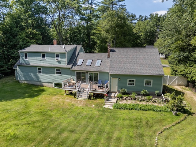 5 Catskill Dr, Merrimack, NH 03054 - rear view of house with a wooden deck, a chimney, a shingled roof, and a gate