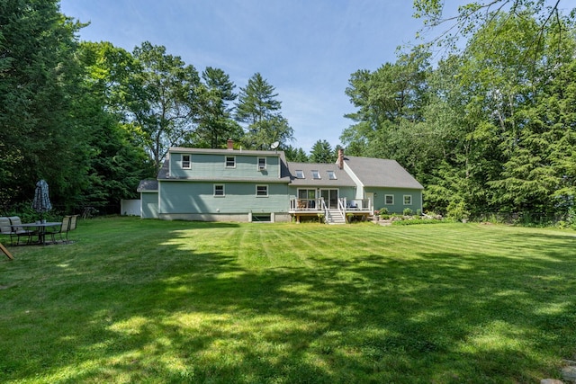 5 Catskill Dr, Merrimack, NH 03054 - rear view of property with a deck, a lawn, and a chimney