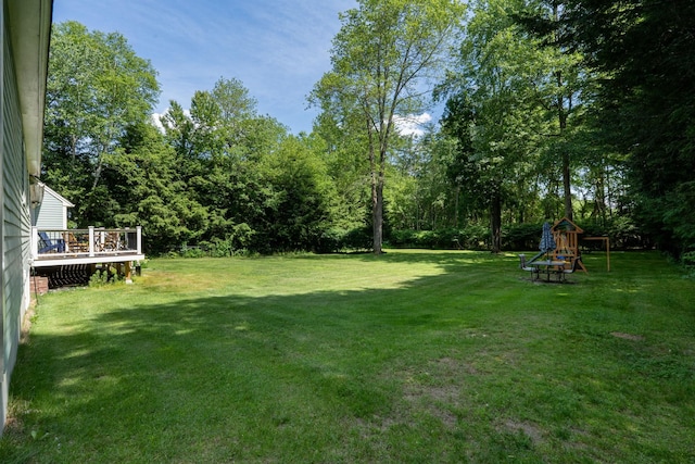 5 Catskill Dr, Merrimack, NH 03054 - view of green lawn featuring a playground and a deck