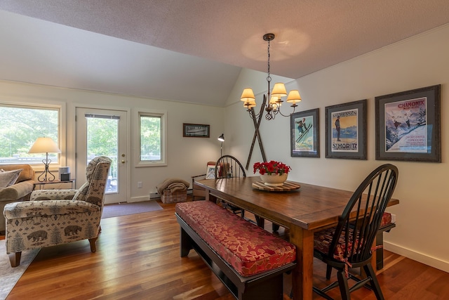 65 Styles Branch Rd Unit 819B, Stratton, VT 05155 - dining area featuring a chandelier, wood finished floors, lofted ceiling, and a textured ceiling