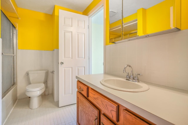 15 Culver St Unit 14, Plaistow, NH 03865 - bathroom featuring vanity, tile patterned flooring, tile walls, and enclosed tub / shower combo