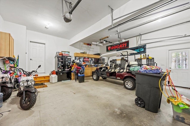 23 Surrey Ln, Laconia, NH 03246 - garage featuring a garage door opener
